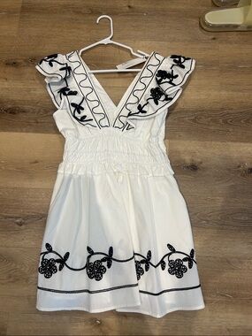 White V-Neck Mini Dress with Black Floral Embroidery